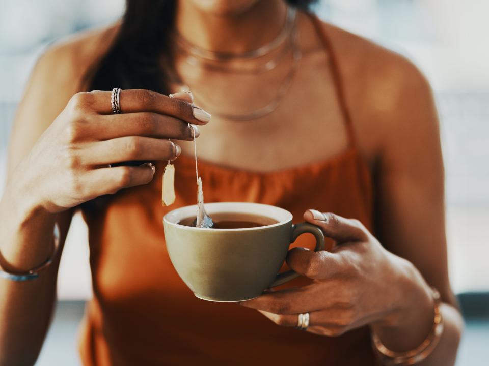 Woman holding herbal tea