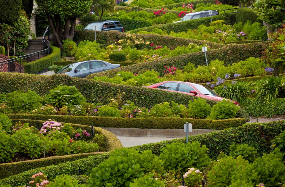 San Francisco's Lombard Street has become one of the city's most visited sites. Tourists often gather to watch as drivers make their way through the hairpin turns. Completed in 1922, the street was designed to slow cars down on its steep hill. Drivers are advised to proceed at 5 m.p.h.