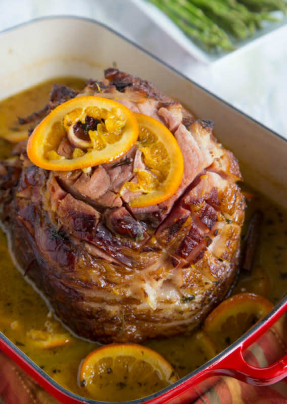 <p>Dinners Dishes And Desserts</p><p>Baked Ham with a Tangerine Glaze is a delicious oven-baked ham with a sweet tangerine glaze. Perfect for any Easter or Christmas table.</p><p><strong>Get the recipe: <a href="http://dinnersdishesanddesserts.com/tangerine-glazed-ham/" rel="nofollow noopener" target="_blank" data-ylk="slk:Tangerine Glazed Ham;elm:context_link;itc:0;sec:content-canvas" class="link ">Tangerine Glazed Ham</a></strong></p>