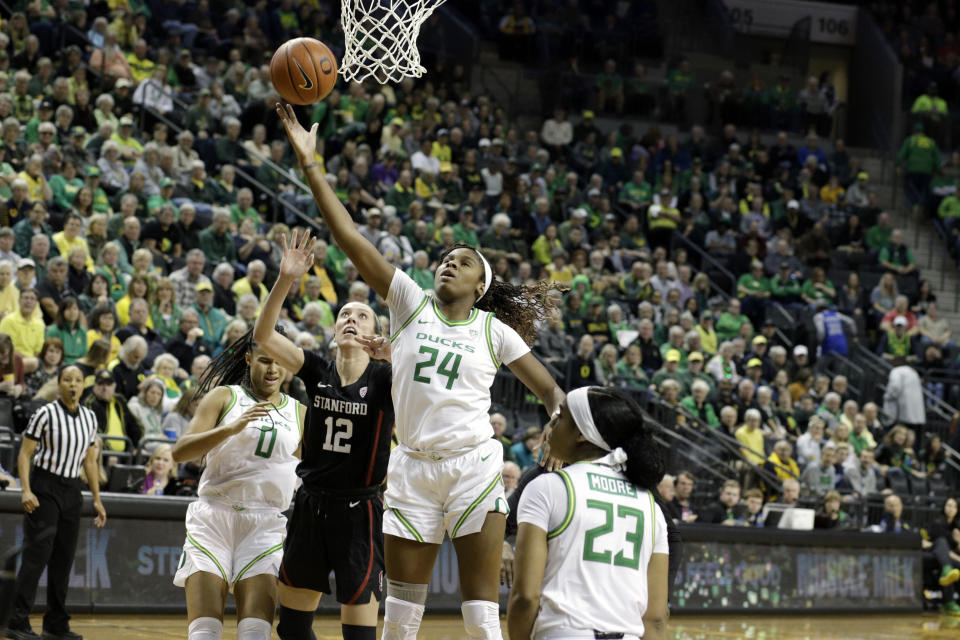 Oregon Ducks forward Ruthy Hebard (24) grabs a rebound against Stanford on Monday in Eugene. Mandatory Credit: Soobum Im-USA TODAY Sports