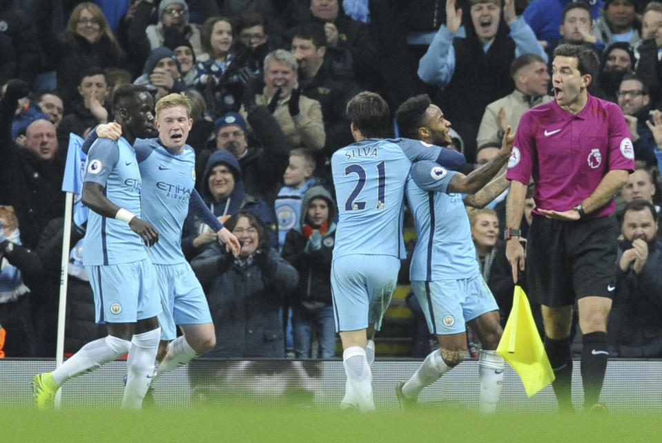 <p>Manchester City’s Raheem Sterling, right, celebrates after scoring during the English Premier League soccer match between Manchester City and Arsenal at the Etihad Stadium in Manchester, England, Sunday, Dec. 18, 2016. (AP Photo/Rui Vieira) </p>