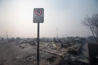 Home foundations and shells of vehicles are nearly all that remain in a residential neighborhood destroyed by a wildfire on May 6, 2016 in Fort McMurray, Alberta. (Photo by Scott Olson/Getty Images)