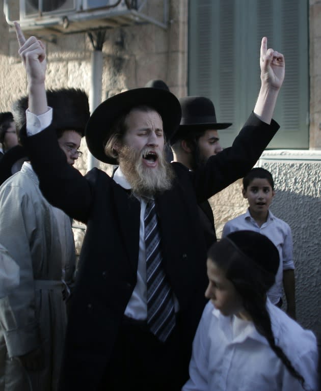 An Ultra-Orthodox Jewish man shouts slogans during a demonstration against the desecration of the Sabbath in central Jerusalem on August 15, 2015