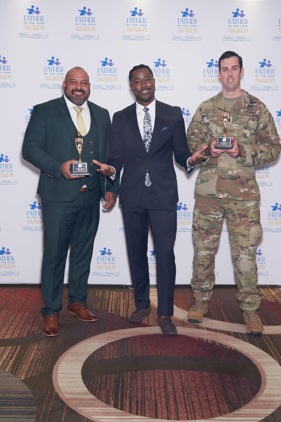 Honoree Vincent Vargas, MC Nate Burleson and the son of John Mulholland.