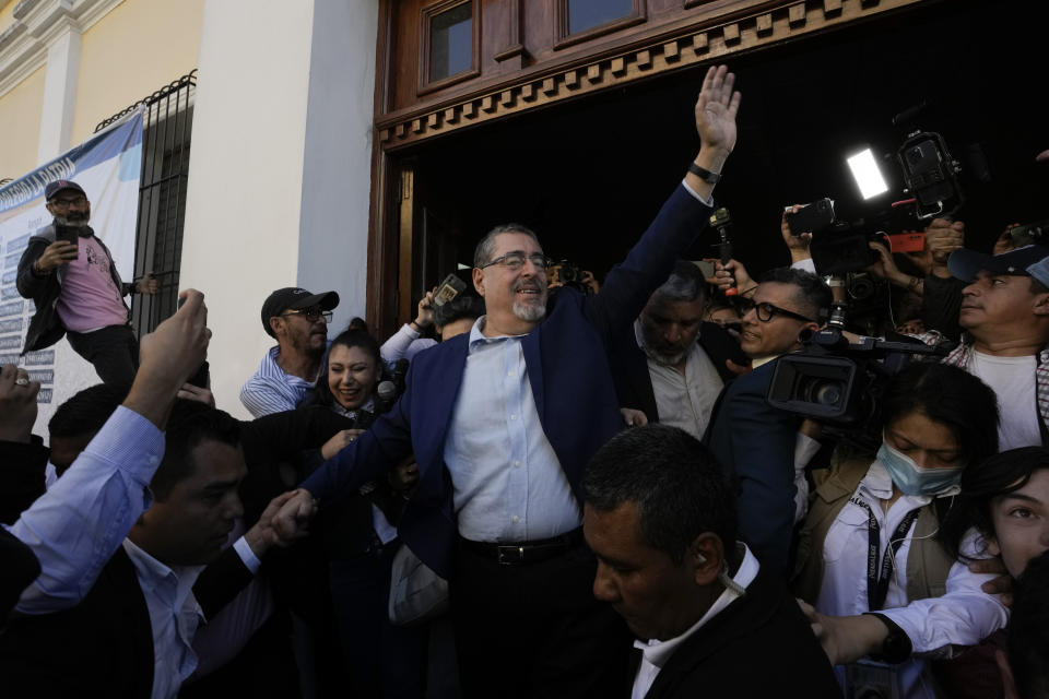 Bernardo Arevalo, presidential candidate with the Semilla Movement, waves after voting in the run-off presidential election in Guatemala City, Sunday, Aug. 20, 2023. (AP Photo/Moises Castillo)