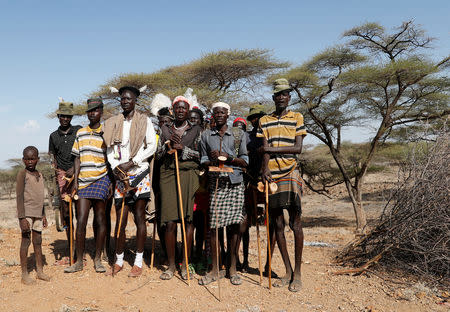 Turkana tribesmen dance around a killed bull during wedding ceremony near Todonyang, Kenya March 22, 2019. REUTERS/Goran Tomasevic