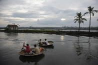 Fishermen row their traditional boats as they set out to fish in the morning in Kochi, Kerala state, India, Monday, June 1, 2020. (AP Photo/ R S Iyer)