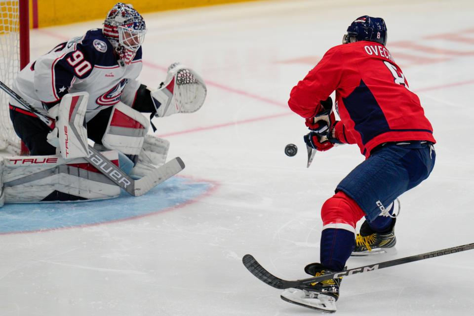 Washington Capitals left wing Alex Ovechkin (8) shoots against Columbus Blue Jackets goaltender Elvis Merzlikins (90) during the third period of an NHL hockey game Saturday, Nov. 4, 2023, in Washington. (AP Photo/Jess Rapfogel)