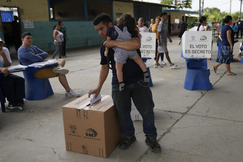 A man votes in the snap election, in Guayaquil, Ecuador, Sunday, Aug. 20, 2023. The special election was called after President Guillermo Lasso dissolved the National Assembly by decree in May to avoid being impeached. (AP Photo/Martin Mejia)