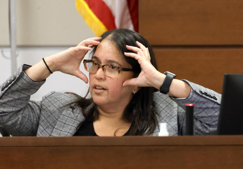 FILE - Medical Examiner Dr. Wendolyn Sneed describes the wounds of Marjory Stoneman Douglas High School victims as she testifies in the penalty phase of Marjory Stoneman Douglas High School shooter Nikolas Cruz's trial at the Broward County Courthouse in Fort Lauderdale, Fla., on Monday, July 25, 2022. (Carline Jean/South Florida Sun-Sentinel via AP, Pool, File)