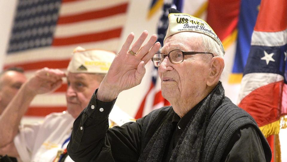 Adone "Cal" Calderone, who survived Pearl Harbor aboard the USS West Virginia, salutes the flag during national anthem at a memorial service for veterans at American Legion Post 44 on Dec. 7, 2018, when he was 98. He died at age 100 in 2020.