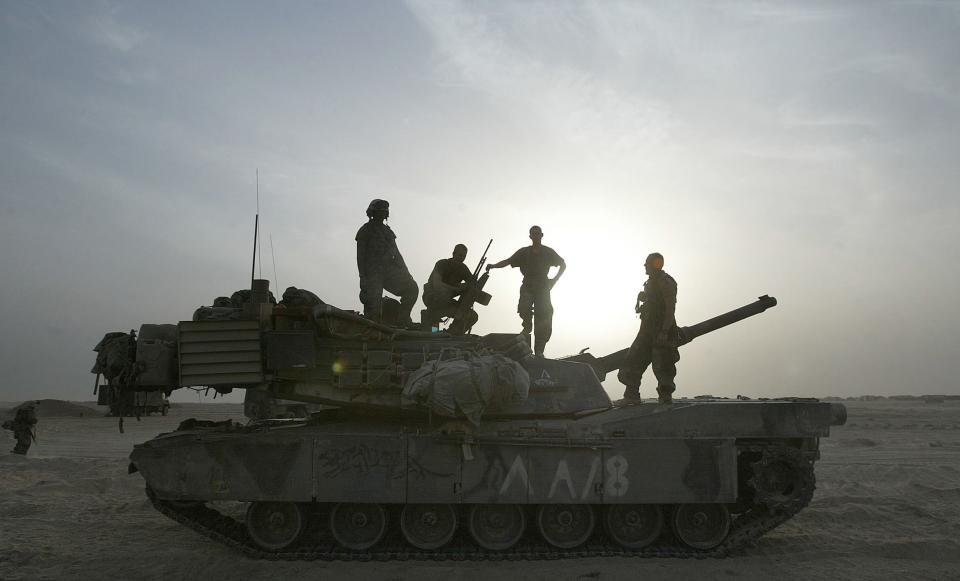 Marines of the 8th Tanks Alpha company out of Fort Knox, Kentucky atop their M1A1 Abrams Tank. (Michael Macor/San Francisco Chronicle via AP)
