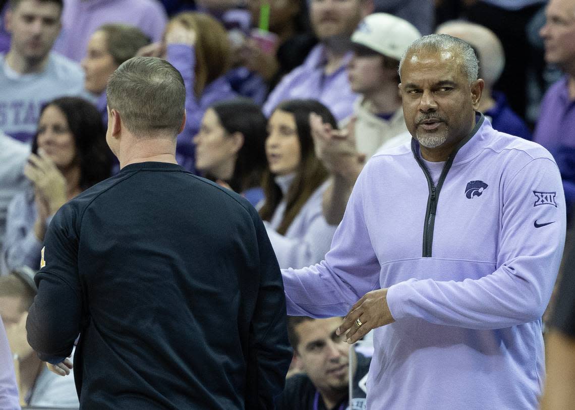 Kansas State coach Jerome Tang shakes hands with Wichita State coach Paul Mills after Kansas State’s 69-60 win over the Shockers on Thursday night at the T-Mobile Center in Kansas City. Tang and Mills were assistant coaches together at Baylor.