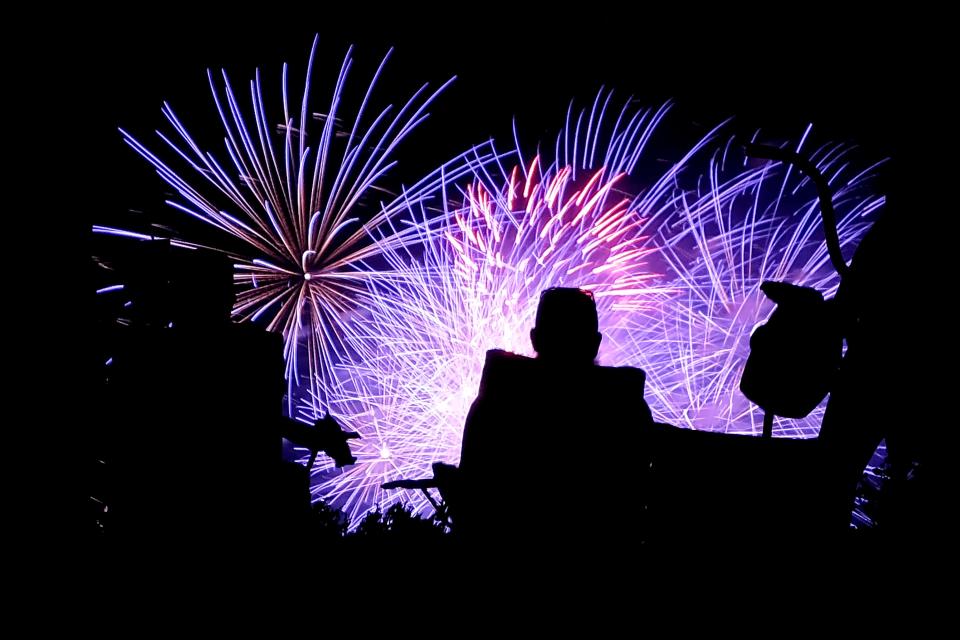 People watch the fireworks show at Chisholm Trail Park during the Yukon Freedom Fest, Saturday, July 3, 2021.