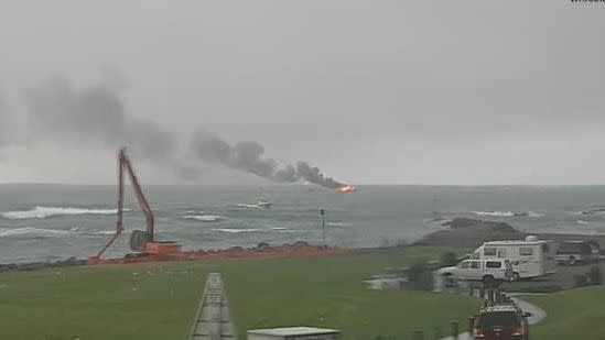 The flames could be seen from the shore. Photo: Whakatane Coastguard