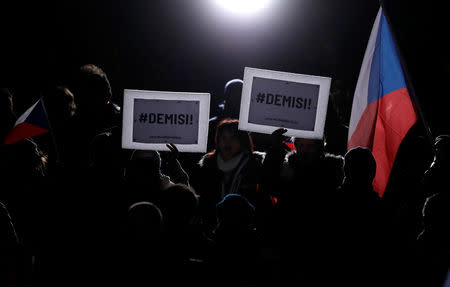 Demonstrators hold banners during a protest rally demanding resignation of Czech Prime Minister Andrej Babis in Prague, Czech Republic, November 23, 2018. Banners read: "Resign!". REUTERS/David W Cerny