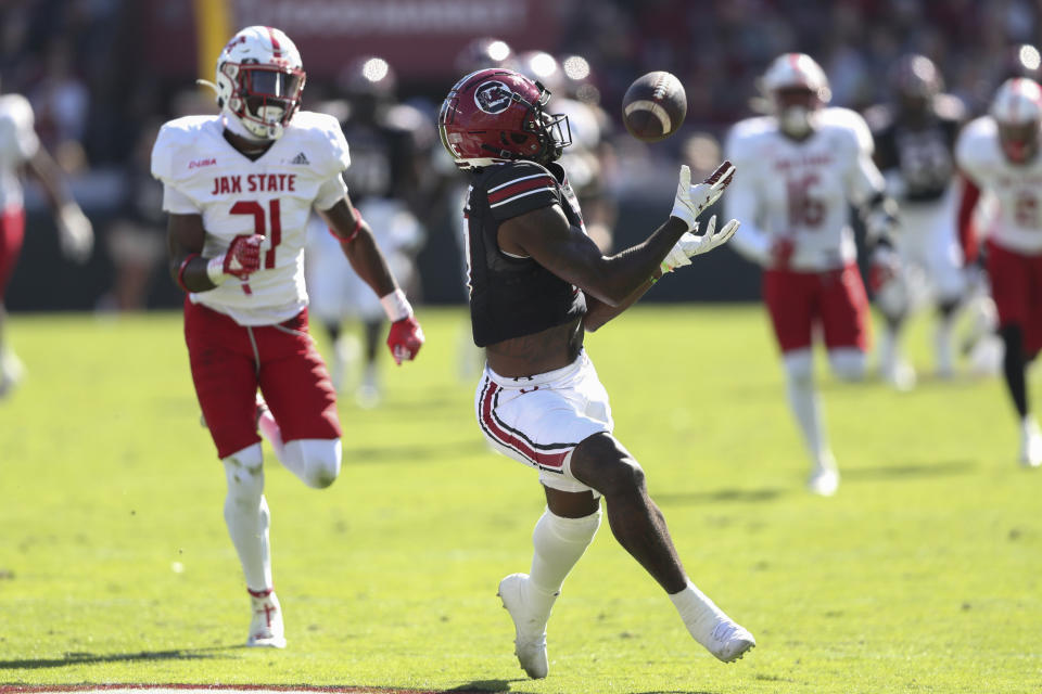 South Carolina wide receiver Xavier Legette (17) catches a 52-yard pass over Jacksonville State defensive back Ky'won McCray (21) during the first half of an NCAA college football game on Saturday, Nov. 4, 2023, in Columbia, S.C. (AP Photo/Artie Walker Jr.)