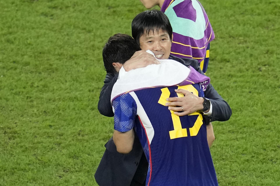 Japan's head coach Hajime Moriyasu embraces Japan's Hiroki Sakai at the end of the World Cup round of 16 soccer match between Japan and Croatia at the Al Janoub Stadium in Al Wakrah, Qatar, Monday, Dec. 5, 2022. (AP Photo/Ricardo Mazalan)