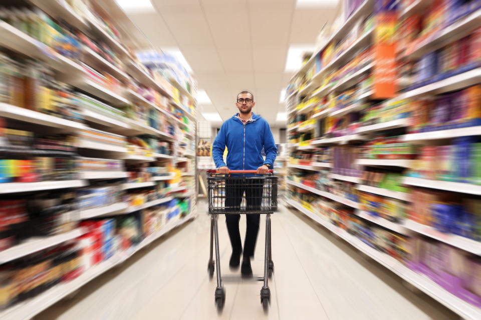 Households in the UK are continuing to cut back on essentials such as groceries. (Getty)