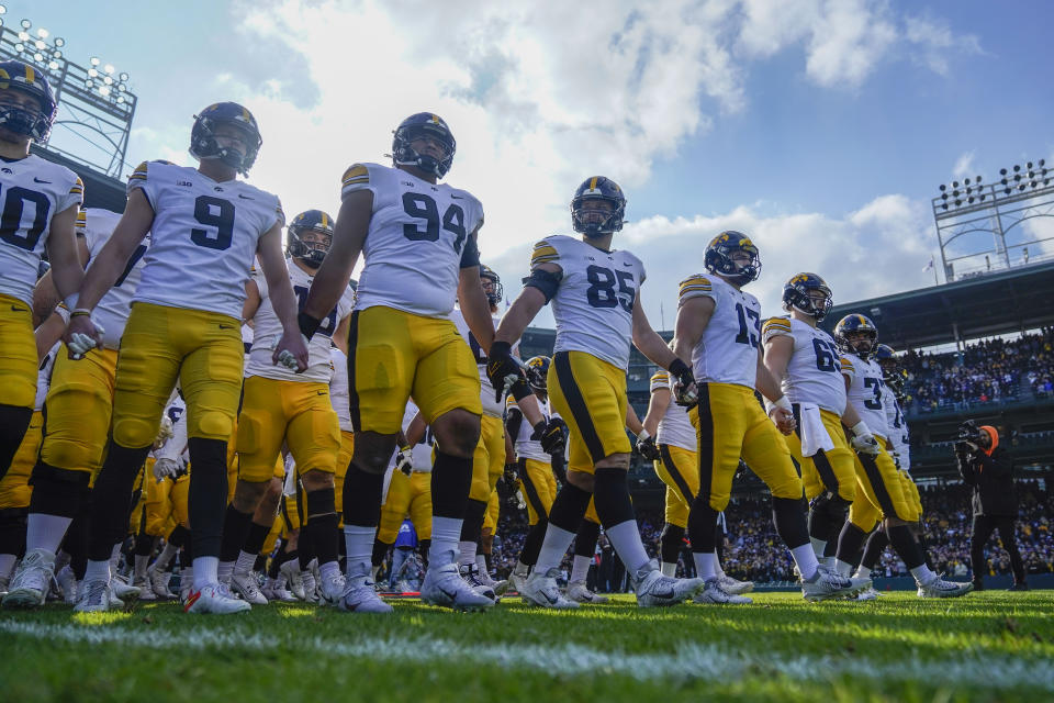 Iowa takes the field for the first half of an NCAA college football game against Northwestern, Saturday, Nov. 4, 2023, at Wrigley Field in Chicago. (AP Photo/Erin Hooley)
