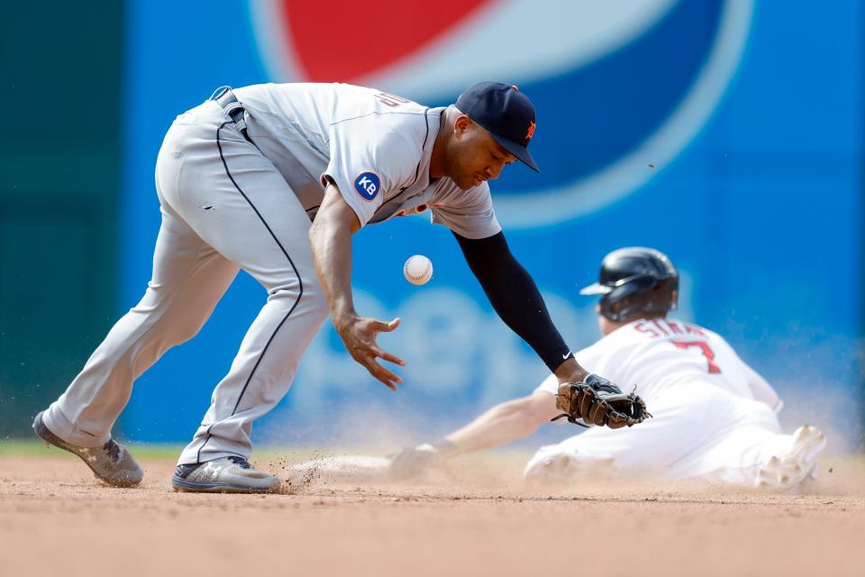 Tigers second baseman Jonathan Schoop tries to control the ball as Guardians' Myles Straw steals second base during the fifth inning in the first game of a doubleheader Monday, Aug. 15, 2022, in Cleveland.