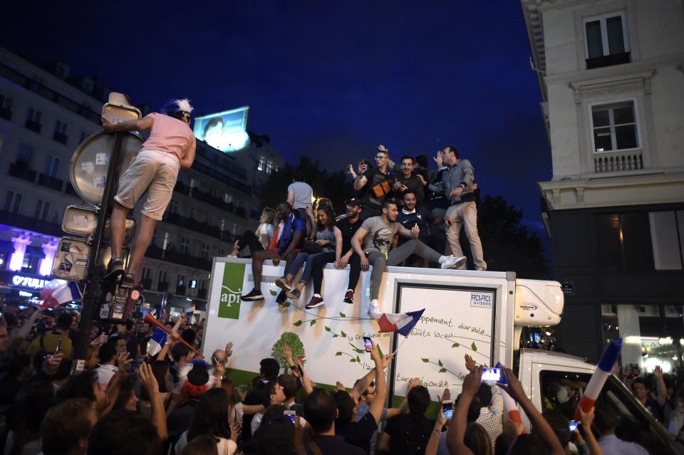 <p>People celebrate France’s victory in central Paris on July 10, 2018 after the final whistle of the Russia 2018 World Cup semi-final football match between France and Belgium. (Photo by Lucas BARIOULET / AFP) </p>