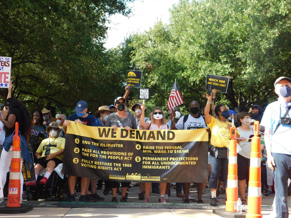 FILE - In this July 31, 2021 file photo, protesters march for voting rights at the Texas Capitol in Austin, Texas. Texas Gov. Greg Greg Abbott on Thursday, Aug. 5 ordered another special legislative session to again try passing a GOP voting bill after Democrats left the state in protest to again prevent Republicans from changing elections laws.(AP Photo/Acacia Coronado File)