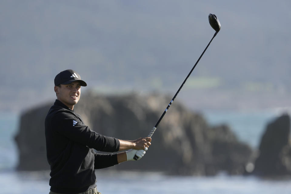 Ludvig Åberg watches his shot from the 18th tee at Pebble Beach Golf Links during the second round of the AT&T Pebble Beach National Pro-Am golf tournament in Pebble Beach, Calif., Friday, Feb. 2, 2024. (AP Photo/Eric Risberg)