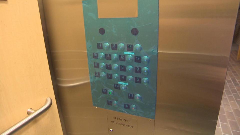 Residents in the apartment building say feces were smeared on these elevator keys, leading to a piece of plastic being placed across them to limit contamination.