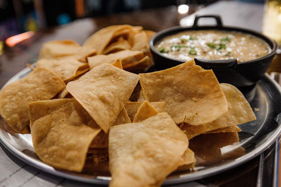 Remi's Arcade & Bistro's Chips and Tequila Queso features sausage and veggie queso with tequila and chips.