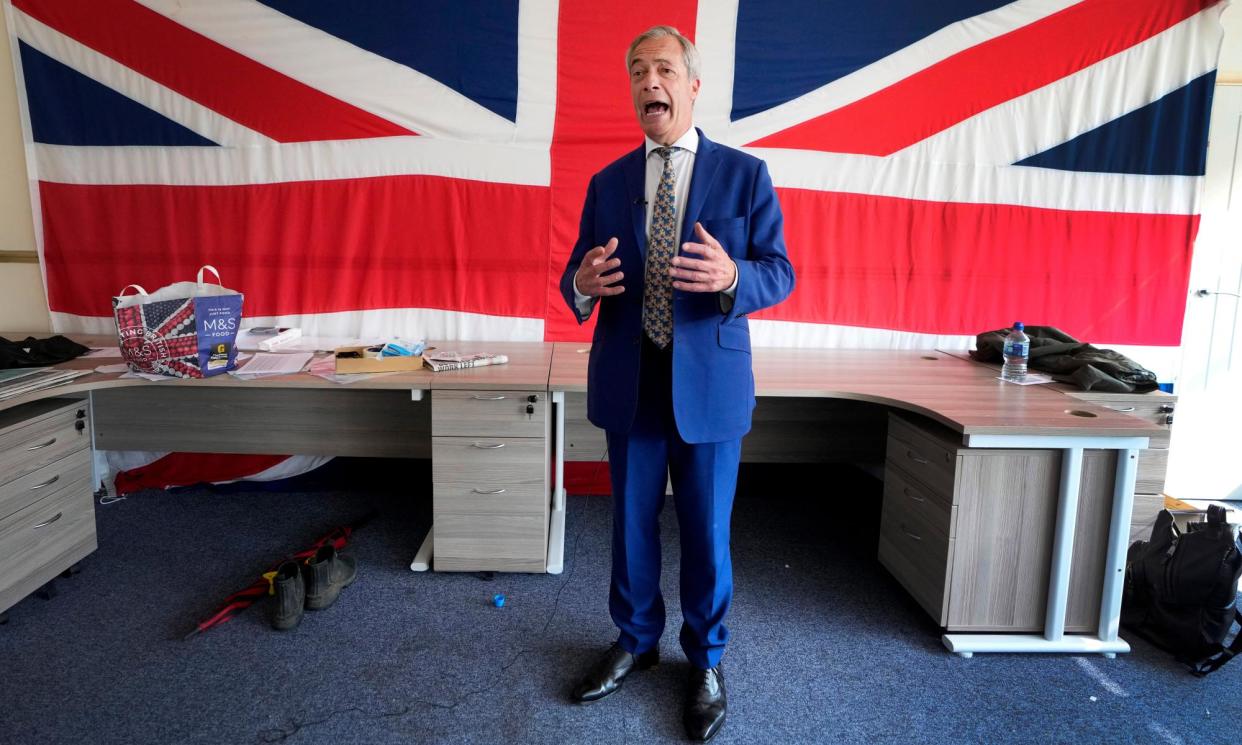 <span>Nigel Farage at Reform UK’s office in Clacton-on-Sea.</span><span>Photograph: Kirsty Wigglesworth/AP</span>