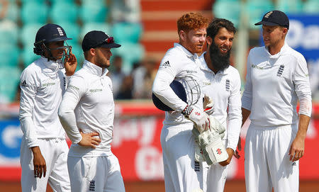 Cricket - India v England - Second Test cricket match - Dr. Y.S. Rajasekhara Reddy ACA-VDCA Cricket Stadium, Visakhapatnam, India - 18/11/16. England's Moeen Ali (2nd R) celebrates with team mates after taking the wicket of India's Wriddhiman Saha. REUTERS/Danish Siddiqui