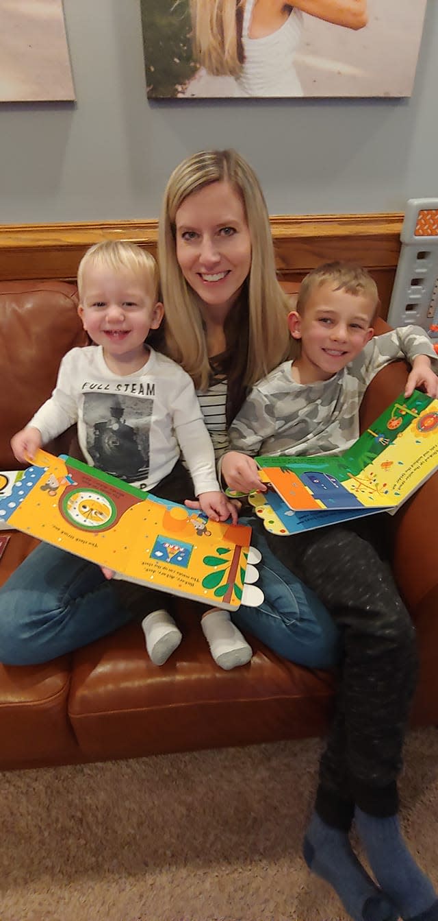 Benji and Theo reading with their mom, and my sister-in-law, Chelsea.