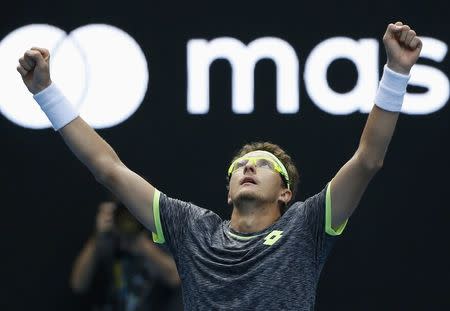 Tennis - Australian Open - Melbourne Park, Melbourne, Australia - 19/1/17 Uzbekistan's Denis Istomin celebrates after winning his Men's singles second round match against Serbia's Novak Djokovic. REUTERS/Issei Kato