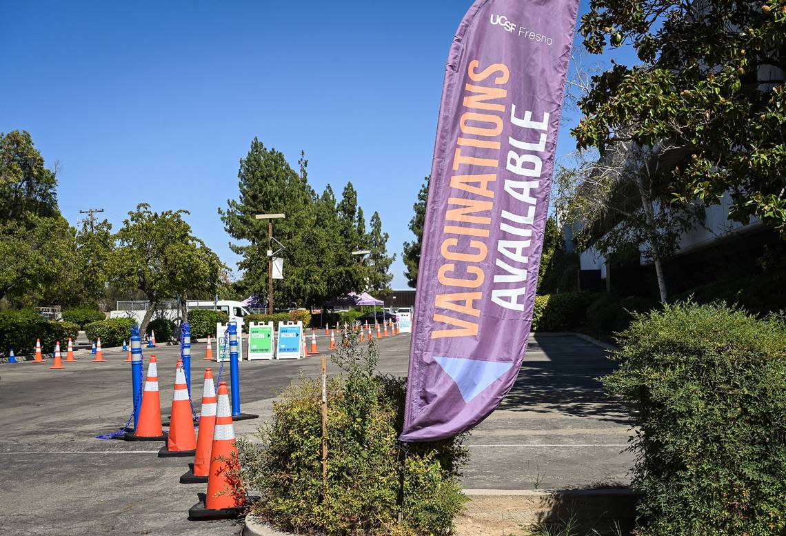 Signs point the way to the COVID-19 drive-thru vaccination station at UCSF Fresno’s COVID-19 Equity Project medical clinic in Fresno on Tuesday, Aug. 23, 2022. Drive-thru vaccinations will also become available for monkeypox.