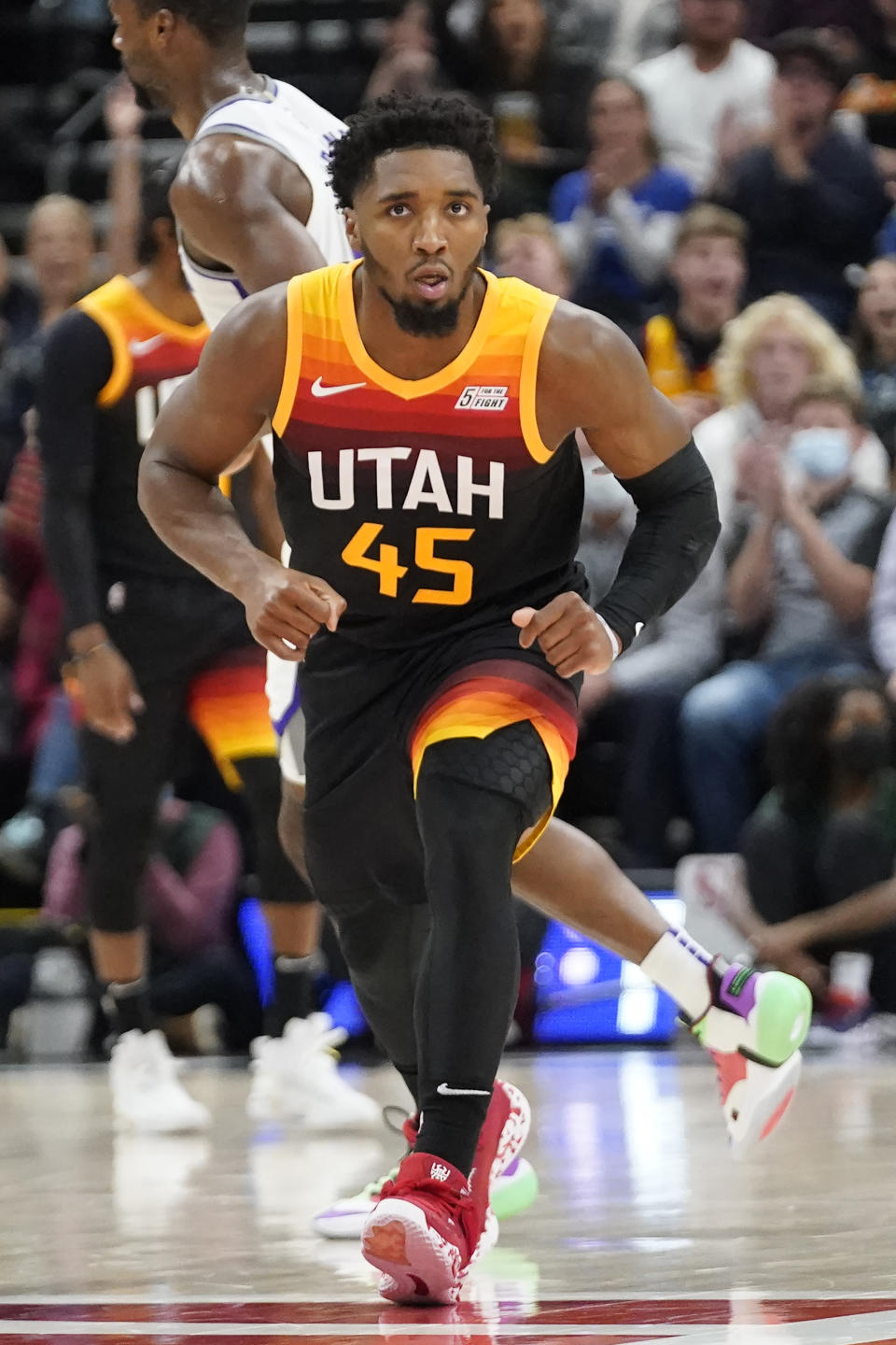 Utah Jazz guard Donovan Mitchell (45) runs up court after making a 3-pointer against the Sacramento Kings in the first half during an NBA basketball game Tuesday, Nov. 2, 2021, in Salt Lake City. (AP Photo/Rick Bowmer)