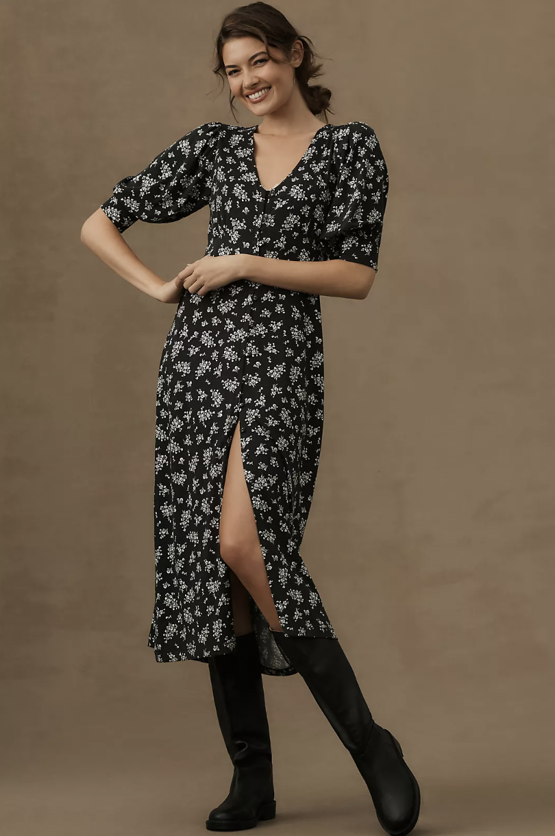 model wearing black boots and knee-length floral black Grey State Greta Midi Dress (photo via Anthropologie)