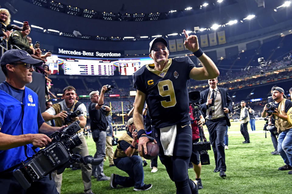 New Orleans Saints quarterback Drew Brees (9) runs off the field after defeating the Indianapolis Colts 34-7 in an NFL football game in New Orleans, Monday, Dec. 16, 2019. Brees broke the NFL record for career touchdown passes, surpassing Peyton Manning, and the all-time single game completion percentage as well. (AP Photo/Bill Feig)