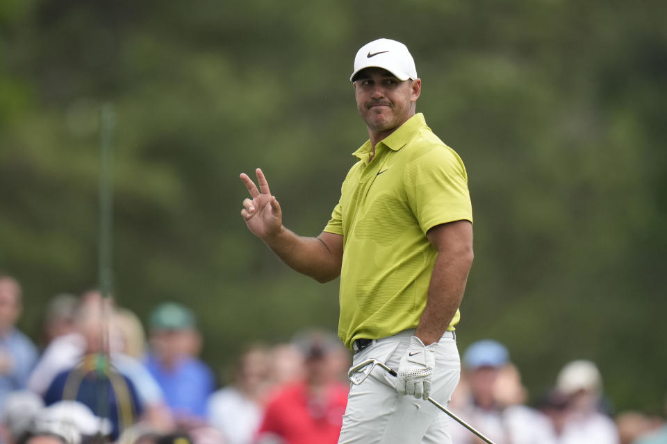 Brooks Koepka waves after his shot on the 12th hole during the first round of the Masters golf tournament at Augusta National Golf Club on Thursday, April 6, 2023, in Augusta, Ga. (AP Photo/Jae C. Hong)