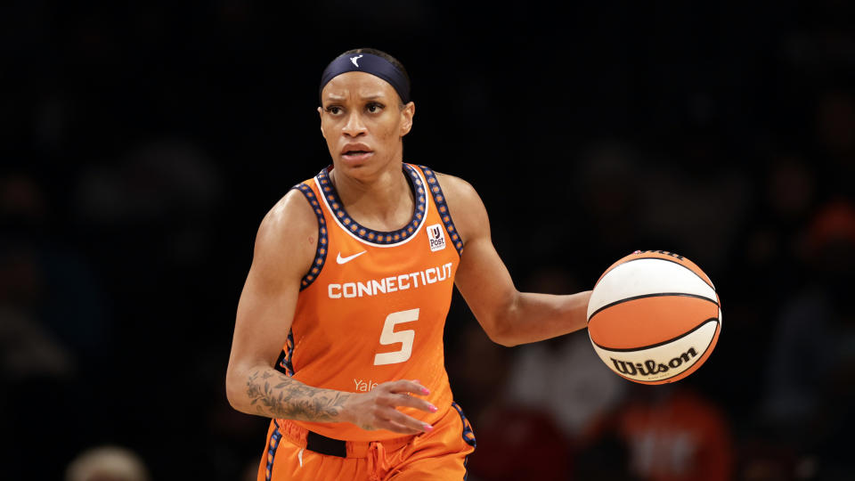 Sun guard Jasmine Thomas looks to pass against the New York Liberty during a 2022 game in New York. (AP Photo/Adam Hunger)