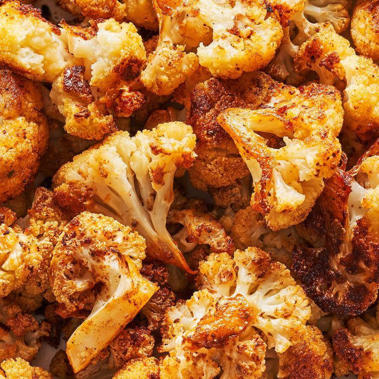 <p>Cauliflower is one of our favorites to roast because, flavor-wise, it's very much a blank canvas. You can keep it simple with just salt and pepper or go nuts with a custom spice blend. Our recipe adds just a touch of color and zesty flavor with Old Bay seasoning, but feel free to get creative!</p><p>Get the <strong><a href="https://www.delish.com/cooking/recipe-ideas/a37727549/roasted-cauliflower-recipe/" rel="nofollow noopener" target="_blank" data-ylk="slk:Roasted Cauliflower recipe;elm:context_link;itc:0" class="link ">Roasted Cauliflower recipe</a></strong>.</p>