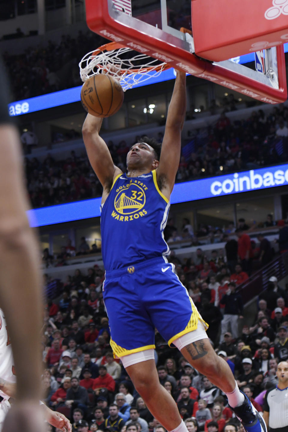 Golden State Warriors' Trayce Jackson-Davis (32) dunks during the second half of the team's NBA basketball game against the Chicago Bulls Friday, Jan 12, 2024, in Chicago. (AP Photo/Paul Beaty)