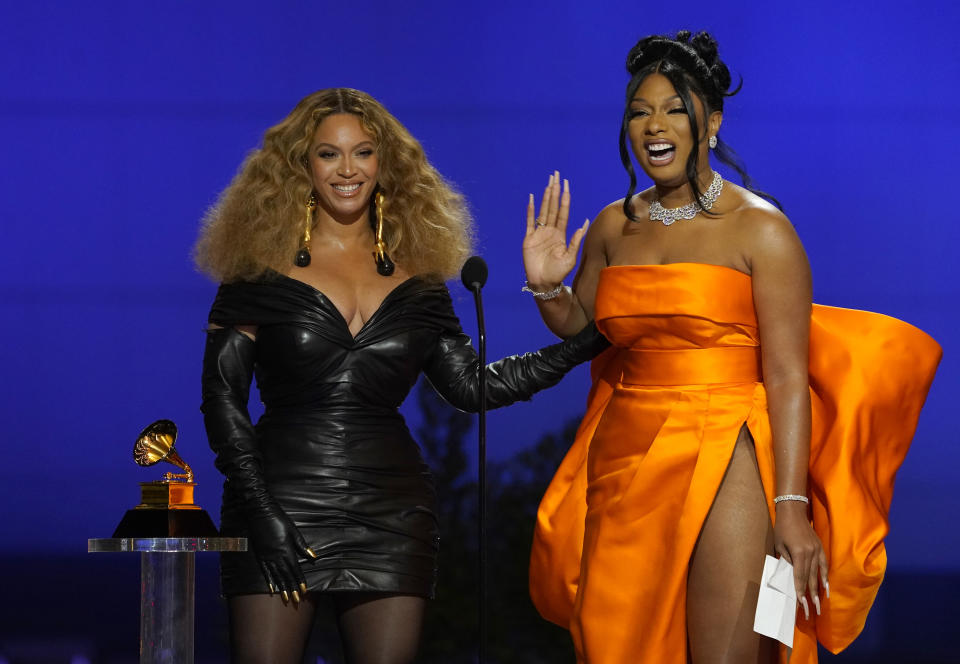 Beyonce, left, and Megan Thee Stallion accept the award for best rap song for "Savage" at the 63rd annual Grammy Awards at the Los Angeles Convention Center on Sunday, March 14, 2021. (AP Photo/Chris Pizzello)