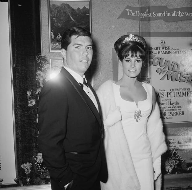 Raquel Welch and husband Patrick Curtis attend the premiere of "<a href="https://parade.com/1136960/jerylbrunner/the-sound-of-music/" rel="nofollow noopener" target="_blank" data-ylk="slk:The Sound of Music;elm:context_link;itc:0;sec:content-canvas" class="link ">The Sound of Music</a>" in Los Angeles on March 10, 1965.<p><a href="https://www.gettyimages.com/detail/1142823643" rel="nofollow noopener" target="_blank" data-ylk="slk:Graphic House/Getty Images;elm:context_link;itc:0;sec:content-canvas" class="link ">Graphic House/Getty Images</a></p>