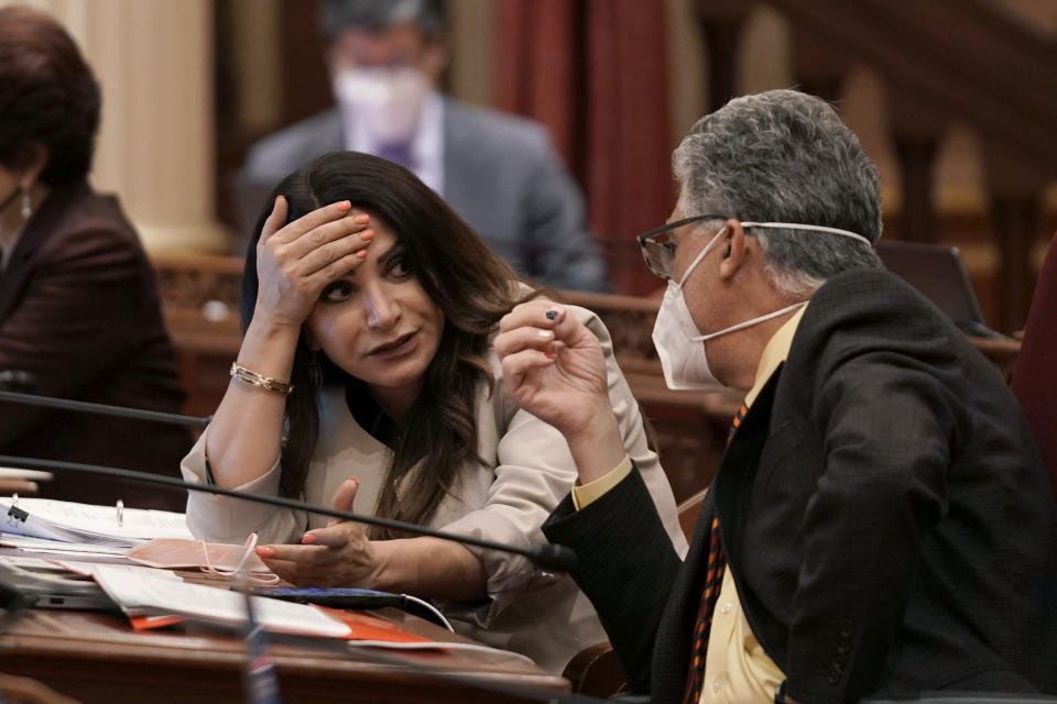 State Sen. Susan Rubio, D-Baldwin Park, talks with Sen. Anthony Portantino, D-La Canada Flintridge, at the Capitol in Sacramento, Calif., Wednesday, June 29, 2022. During an unusual night time session California lawmakers worked on a package of bills to enact the nearly $308 billion budget that includes cash payments for most taxpayers to help offset record high gas prices. (AP Photo/Rich Pedroncelli)