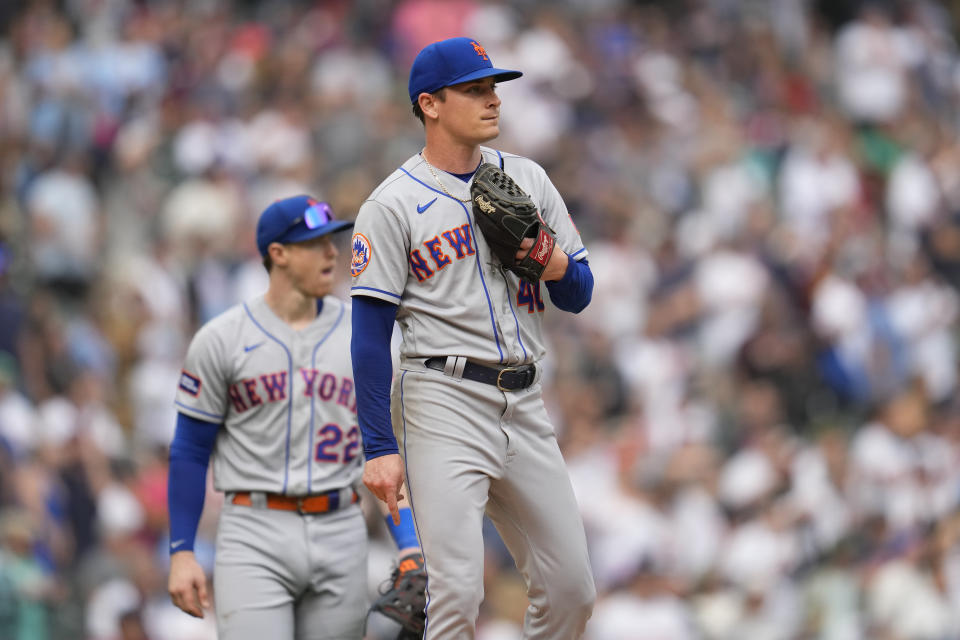 New York Mets relief pitcher Drew Smith, right, reacts after a three-run triple by Minnesota Twins' Max Kepler during the seventh inning of a baseball game Saturday, Sept. 9, 2023, in Minneapolis. (AP Photo/Abbie Parr)