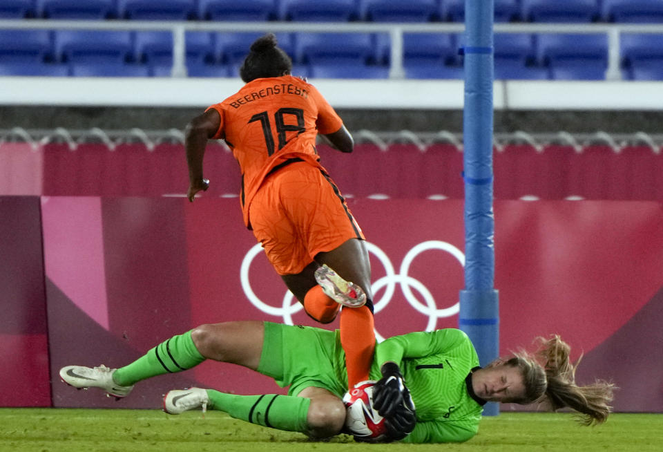 United States' goalkeeper Alyssa Naeher catches the ball as Netherlands' Lineth Beerensteyn challenges her during a women's quarterfinal soccer match at the 2020 Summer Olympics, Friday, July 30, 2021, in Yokohama, Japan. (AP Photo/Kiichiro Sato)