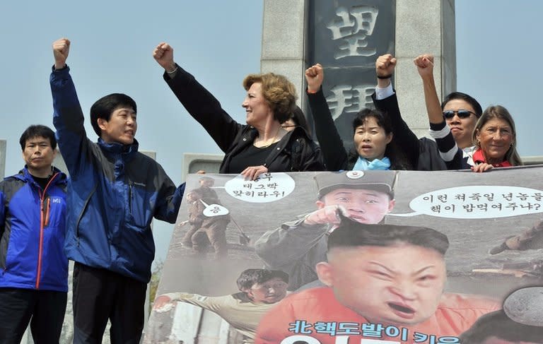 Park Sang-Hak (2nd L), who heads a group of North Korean defectors, and US human rights activist Suzanne Scholte (3rd L) protest after a planned launch of anti-North Korean leaflets near the Demilitarized Zone was blocked on May 4, 2013