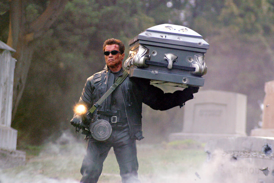 Schwarzenegger's T-850 protects Sarah Connor's supposed coffin in Terminator 3: Rise of the Machines. (Photo: Warner Bros/Courtesy Everett Collection)