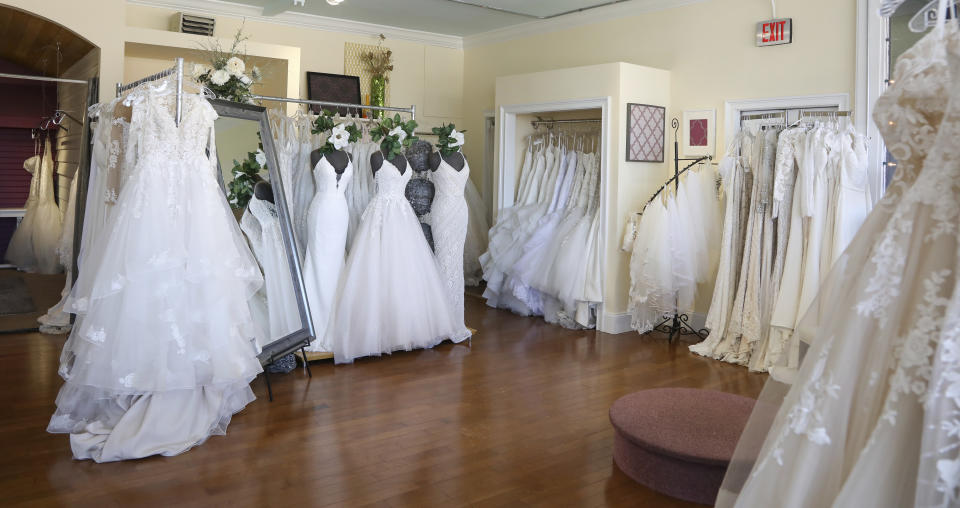 Wedding dresses are displayed at Complete Bridal, a shop in East Dundee, Illinois, on February 28, 2020. The store is heavily reliant on China for manufacturing. Factory closures there have meant fewer choices for brides. Those with weddings coming up soon have to buy off the rack and forego customization. (AP Photo/Teresa Crawford)